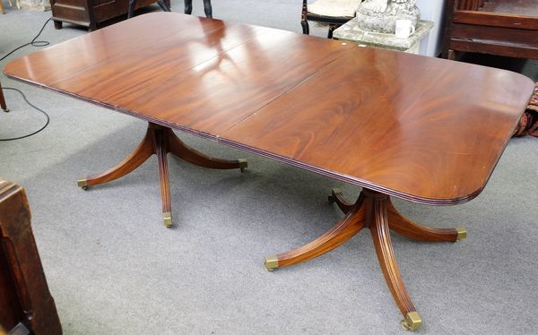 A Regency style mahogany "D" end dining table on eight downswept supports, one extra leaf, 108cm wide x 154cm long x 200cm long extended.  1897