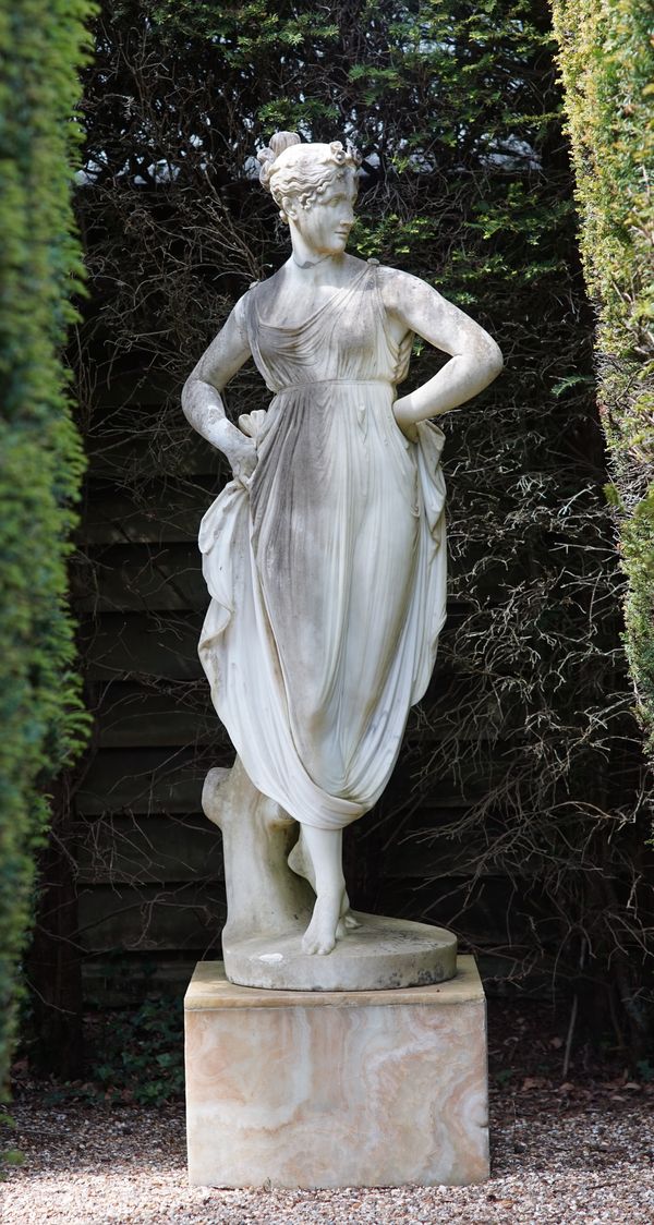 A marble figure of a classical maiden, standing with hands on hips, 19th century (restorations), 173cms high  Illustrated