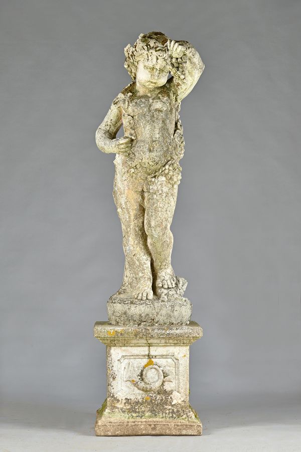 A reconstituted stone figure of a cherub or young Bacchus in standing pose entwined with grapes and vines on stepped square pedestal, 188cm high.  Ill