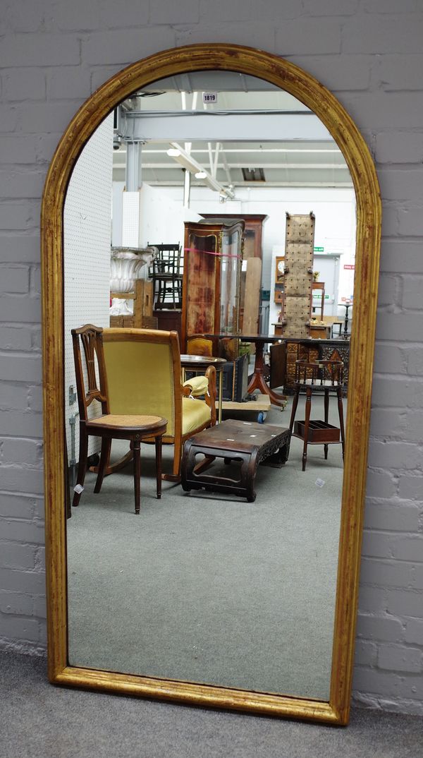 A Victorian style arched giltwood mirror, 83cms wide, 164cms high.