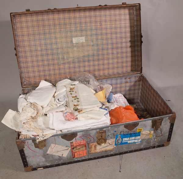 A travel trunk, 90cm wide x 37cm high containing mainly 20th century fabric.