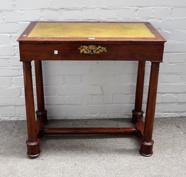 A 20th Century mahogany writing table in the Empire style, leather inset top above fitted drawer, column supports, 78cms wide, 75cms high.