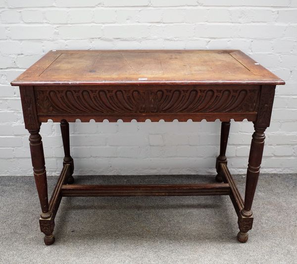 A Victorian carved oak rectangular centre table with gadrooned frieze on turned supports, 100cm wide x 78cm high.