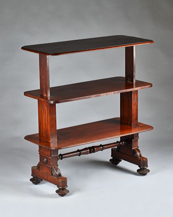 An early Victorian mahogany three-tier metamorphic buffet, of rounded rectangular form, weighted 'rise and fall' mechanism, with solid stepped trestle