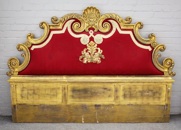 A 20th century gilt framed headboard with shell crest and scroll detail about the tapestry panel, 204cm wide x 146cm high.