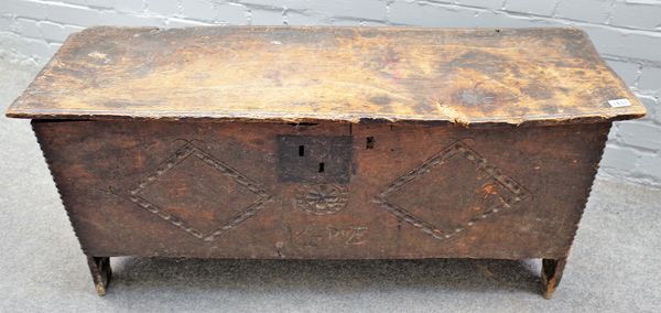 A 17th century oak five plank coffer, the diamond carved front panel detailed HR 1693, 108cm wide x 58cm high.