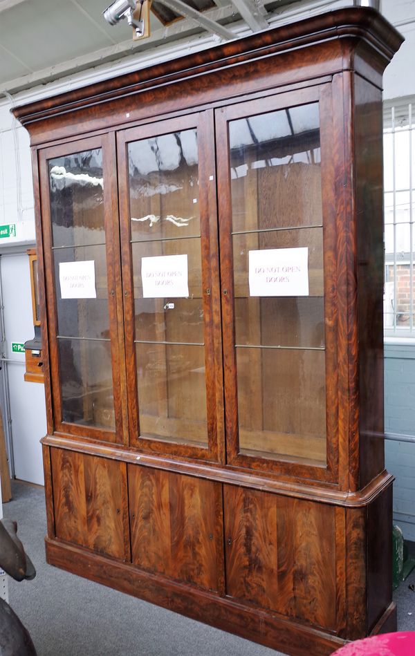 A 19th century French mahogany side cabinet, with three glazed doors, over cupboards, on plinth base, 225cm wide x 283cm high.