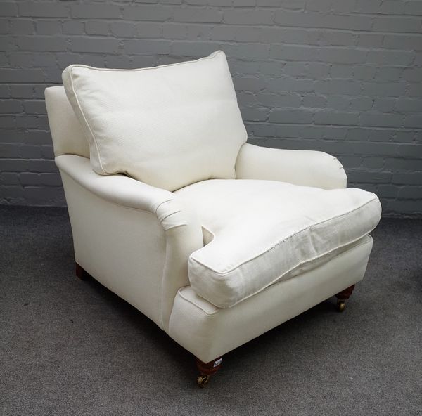 Duresta; a 20th century cream upholstered easy armchair on turned supports, 83cm wide x 76cm high.