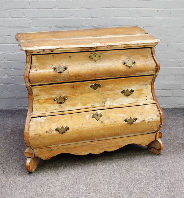 A 19th Century Dutch stripped pine bombé three drawer chest, 100cms wide, 87cms high.