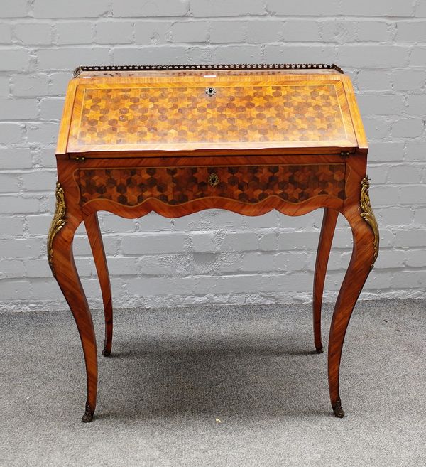 A French 19th century tulipwood and ebony bureau-de-dame, with fitted interior over single drawer on cabriole supports 76cm wide x 87cm high.