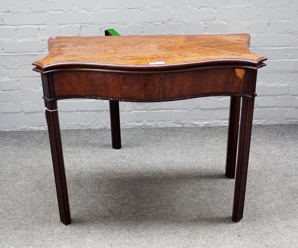 A George III mahogany serpentine card table on channelled block supports, 89cm wide x 74cm high.