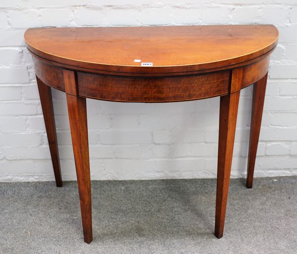 A George III satinwood semi-elliptic card table on tapering square supports, 94cm wide x 76cm high.