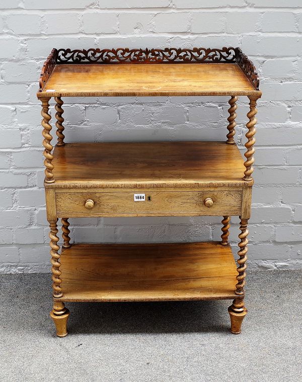 A Victorian rosewood three tier whatnot, with single drawer on barleytwist supports, 61cm wide x 86cm high.