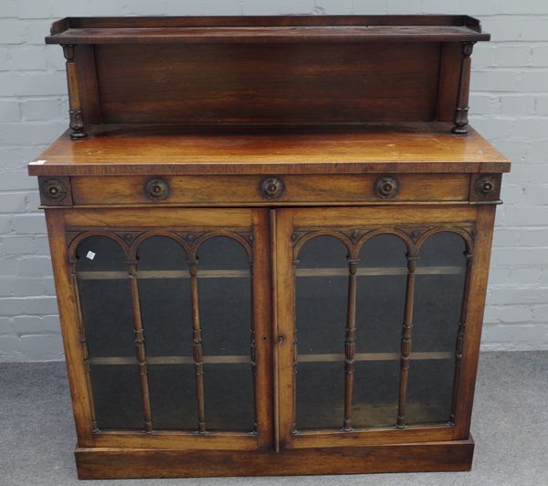 A William IV rosewood chiffonier, the ledge back over drawer and pair of cupboards, 115cm wide x 125cm high.