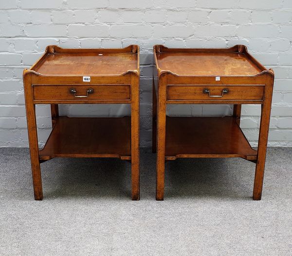 A 20th Century pair of mahogany bedside tables, each with rounded rectangular tray top and single frieze drawer on chamfered moulded legs joined by in