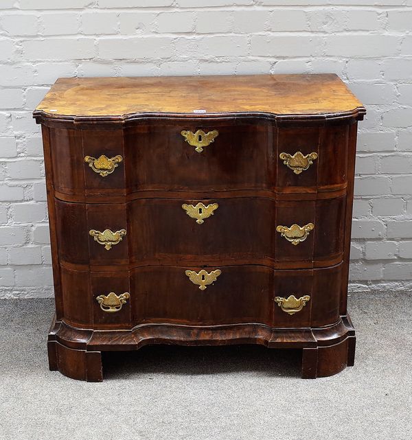 A late 18th German walnut commode of three serpentine drawers, on bracket feet, 88cm wide x 78cm high.