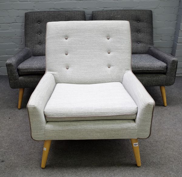 John Lewis; a set of three 1950's style square back easy armchairs on turned beech supports, 75cm wide x 80cm high. (3)