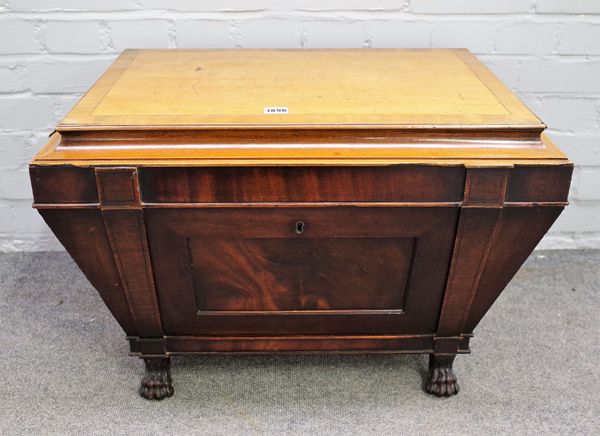 A George IV mahogany wine cooler of sarcophagus form on paw feet, 69cm wide x 48cm high.