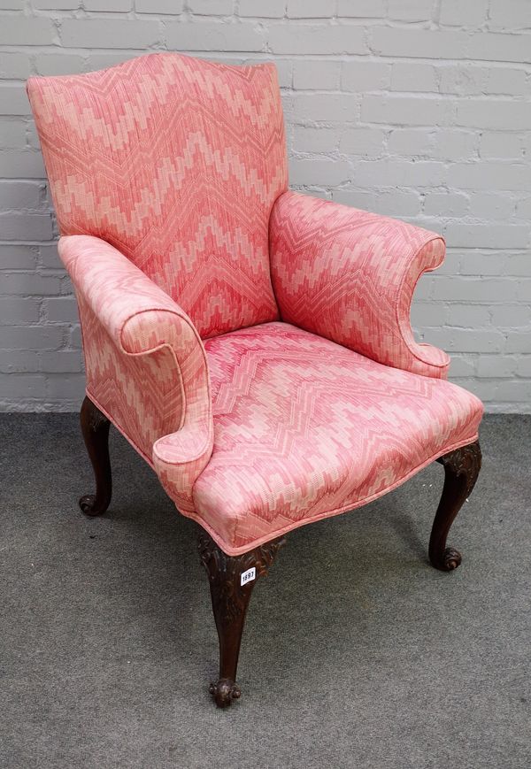 A George III style easy armchair with outswept arms of four scroll mahogany supports, 80cm wide x 100cm high.