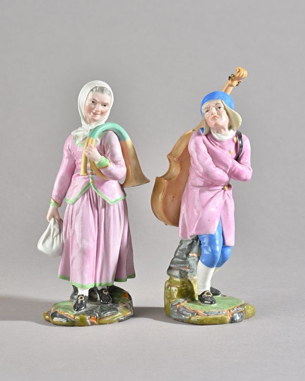 Two Hochst figures of musicians, circa 1780, modelled by J.P. Melchior, he standing cross-armed carrying a cello on his back, she carrying a bundle in