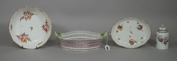 A Berlin porcelain pierced two-handled basket, circa 1800, of shaped oval form, painted with a flower spray and sprigs, branch moulded handles, blue p