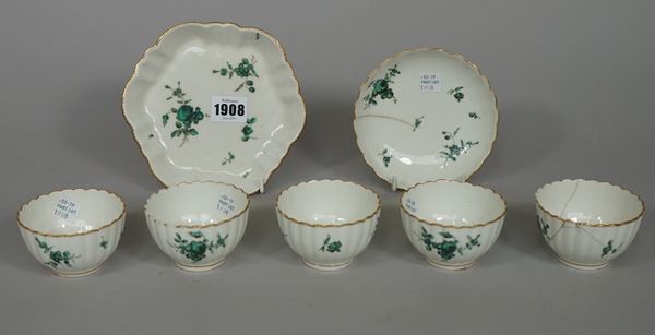 A group of Chelsea-Derby porcelain fluted teawares, circa 1775, each painted with green and black flowers inside gilt dentil rims, comprising; an hexa