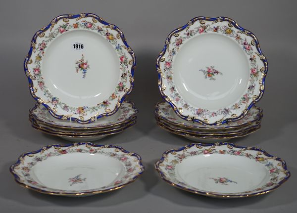 Ten Coalport porcelain plates, circa 1845, each printed and coloured with flowers inside a blue and gilt wavy rim, registration lozenge for 27th Janua