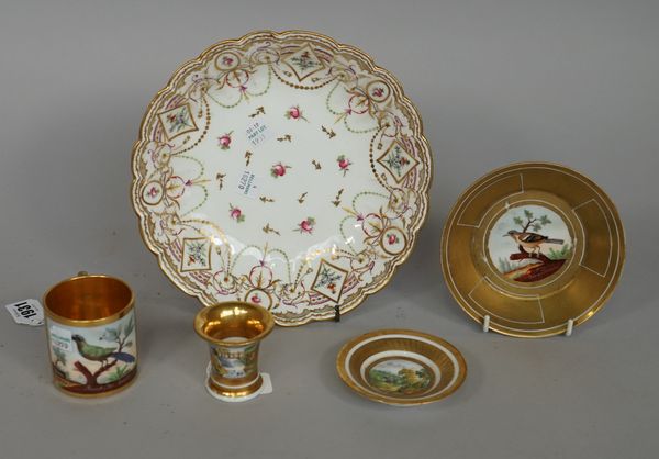 A Paris porcelain gold-ground cabinet cup and saucer, 19th century, each painted with a bird in a branch titled `Momot du bresil' and `pincon des arde