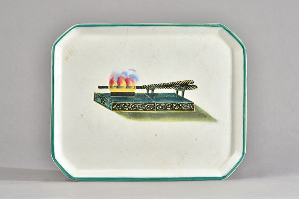 A group of Wemyss pottery, early 20th century, comprising; two canted rectangular comb trays, each painted with a pair of curling tongs on a fire, 26c