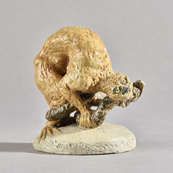 A Martin Brothers stoneware figural group, dated 1890, modelled as a grotesque animal attacking a snake, incised mark,' RW Martin & Bros, London & Sou