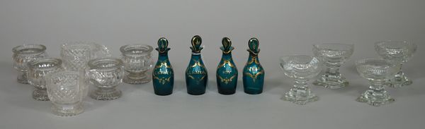 Four coloured glass condiment bottles and stoppers, 19th century, of bluish-green tone, labelled in gilt for Kyan, Catsup, Soy and Lemon, 11.5cm. high