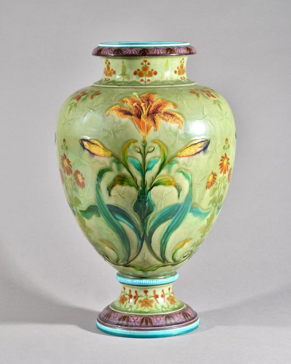 A large Theodore Deck celadon-ground vase, circa 1880, of ovoid form, with spreading circular foot, the sides painted with lilies and daisies, enriche