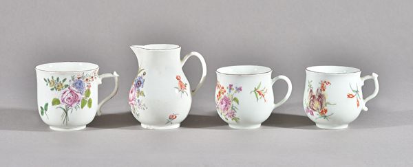 An assembled group of Chelsea porcelain tea and coffee wares, red anchor period, circa 1755, each piece painted with flowers under a chocolate brown r