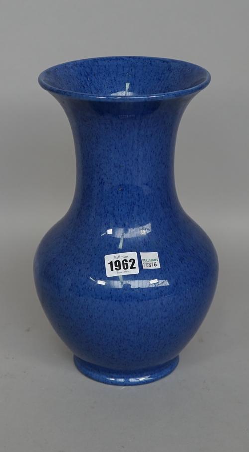 A Moorcroft powder blue pottery vase of baluster form, impressed mark to base, 31cm high.