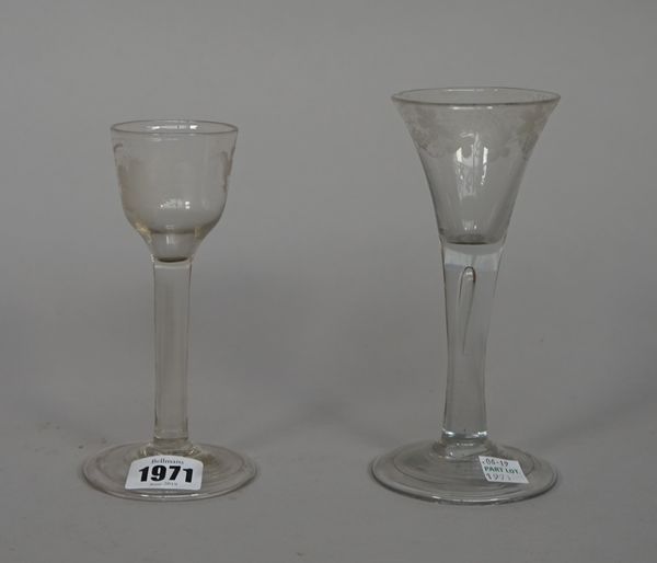 An engraved wine glass, mid 18th century, the ogee bowl engraved with a bird and grapes, raised on a plain stem and folded foot, 15cm. high; also a pl