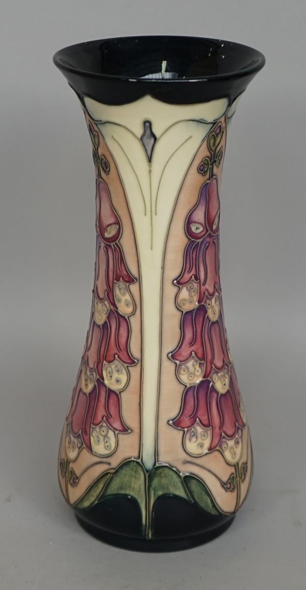 A Moorcroft 'Foxglove' pottery vase of waisted form, impressed and painted marks to base, boxed, 30.5cm high.