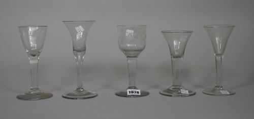 An engraved wine glass, mid 18th century, the large ogee bowl engraved with a bird and fruiting vine, raised on a plain stem and foot, (a.f), 16.5cm.