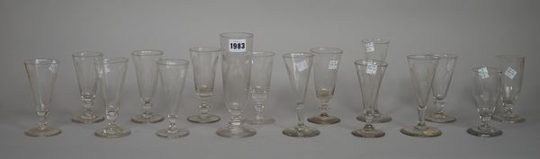 A group of sixteen engraved short ale glasses, late 18th/19th century, of various form and size, each engraved with hops and barley, 12cm. to 18cm. hi