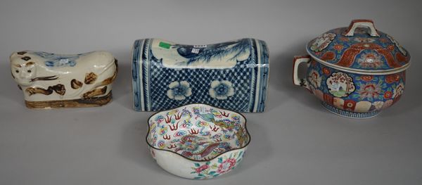 A Chinese blue and white pottery pillow decorated with a duck, 31.5cm wide, another modelled as a cat, a Chinese famille rose two handled pot and cove