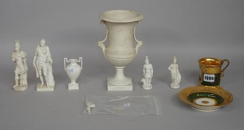 A Paris porcelain gilt/green cabinet cup and saucer (a.f) and six biscuit porcelain items, (7).