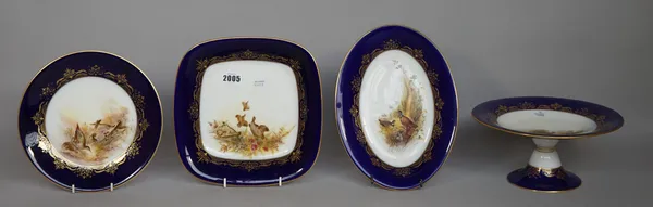 A Royal Worcester porcelain dessert service, circa 1912 and later, hand painted with wild fowl, signed 'Austin' and 'Shuck' comprising, two footed cir