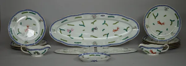 A Herend porcelain fish service, foliate decoration within a basket weave border comprising; an oval fish plate with removable drainers, 61cm wide, tw