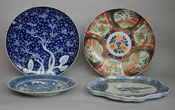 A Chinese famille- rose charger with red printed mark to base, 45.5cm diameter, two further Chinese blue and white chargers and a Chinese shaped servi