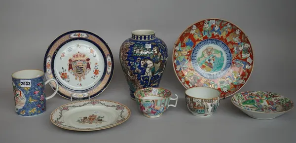 A quantity of Chinese and South East Asian pottery and ceramics including; a Chinese export tankard, 12.5cm high, a Qajar vase, 22cm high, two armoria