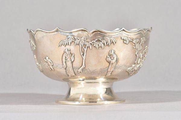 A Chinese bowl, of shaped circular form, decorated with a boat, figures, trees, shrubs and a bridge scene, raised on a circular foot, diameter 16.5cm,
