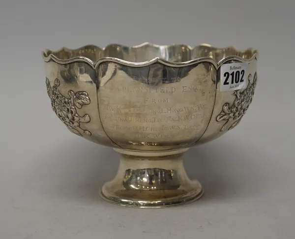 A Chinese bowl, the body decorated with floral sprays within a shaped rim, presentation inscribed, raised on a circular foot, diameter 19cm, weight 39