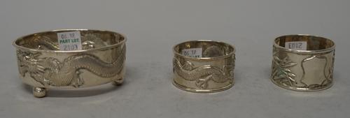 Asian wares, comprising; a Chinese oval salt frame, decorated with a dragon, raised on three feet (the liner lacking), a napkin ring decorated with ba