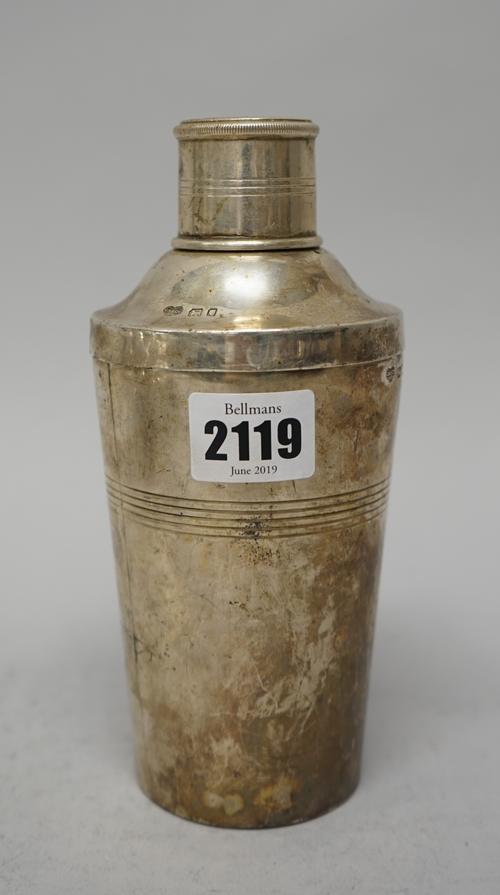 A silver cocktail shaker, of tapered cylindrical form, with a screw top and pull-off lid, in the Art Deco taste, by Goldsmiths and Silversmiths Compan