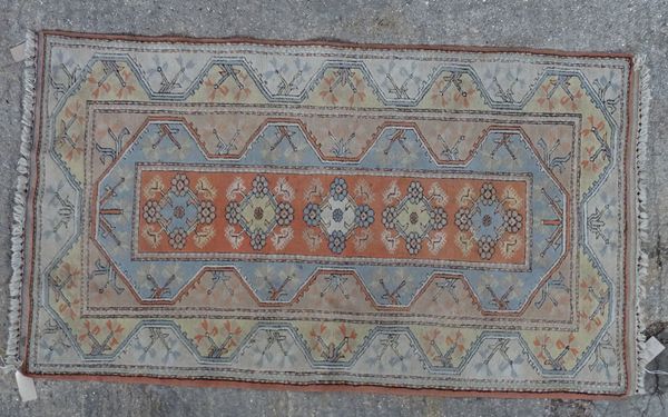 A Turkish rug, 206cm x 118cm.