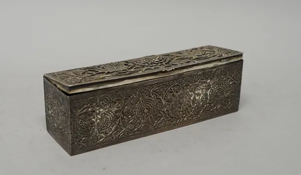 An Asian rectangular hinge lidded box, decorated to the cover and to the sides, with a variety of flowers and leaves, length 20.3cm, weight 390 gms.